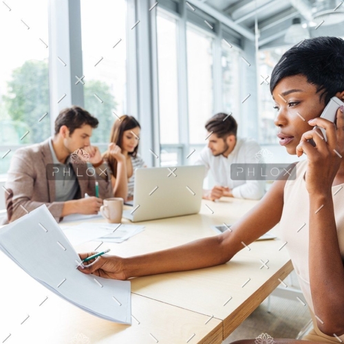 demo-attachment-133-serious-businesswoman-with-documents-talking-on-P9Q6LX6